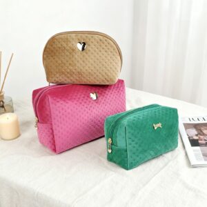 New trends in 2026 brown green Pearl gloss velvet spot debossed Comfortable soft Makeup bag cosmetic bag Heart-shaped bow logo