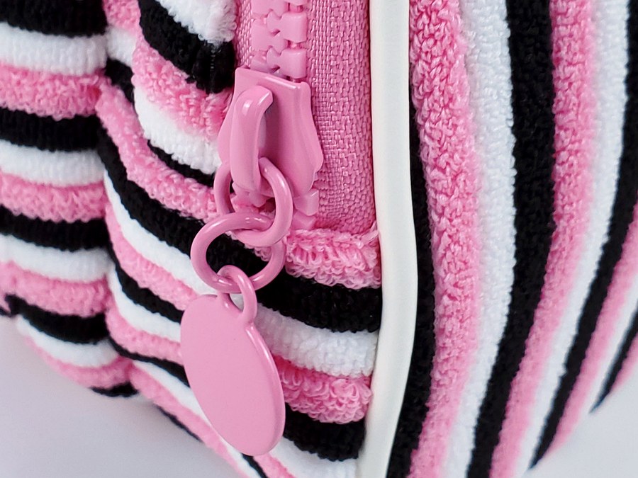 Striped terry cosmetic bag zipper pull tag detail